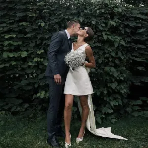 Short Satin V Neck Bridal Gown with Large Bow Sleeveless Open Back Wedding Dress